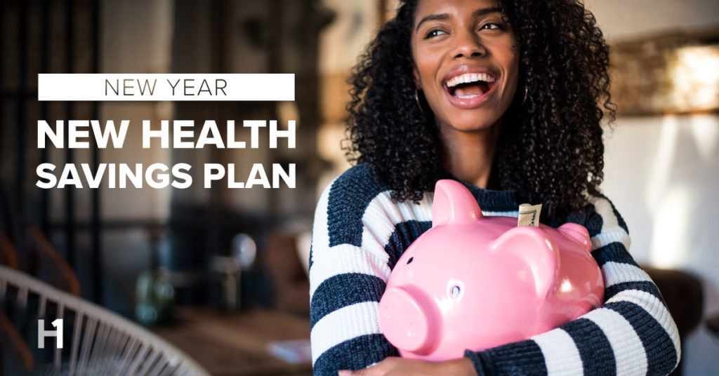 New Year, New Health Savings Plan. Young woman holds piggy bank.